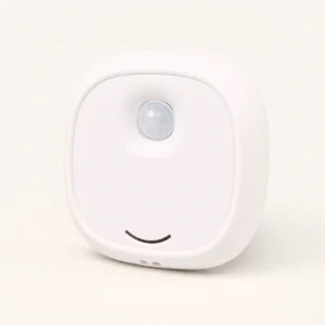 White Puppy Corner Odor Eliminator with its round motion sensor